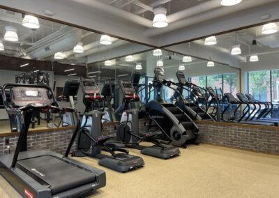 Fitness center in our Detroit apartment building features cardio and strength equipment for a full body workout
