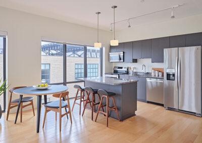 Our Detroit Corktown apartments feature stainless steel appliances, granite countertops, an island for prepping, dining or entertaining, plus an eating area.